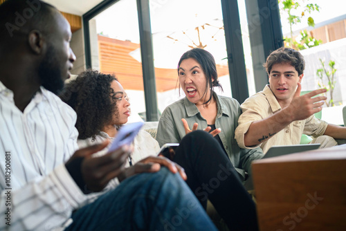 A mixed-gender group of young adult executives in casual work attire engages enthusiastically in a collaborative brainstorming session at a well-lit modern office space.