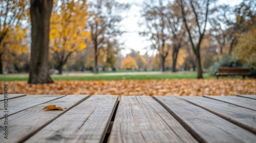 Fall promotions, seasonal displays, or nature-themed designs can be displayed on this wooden table with autumn leaves.