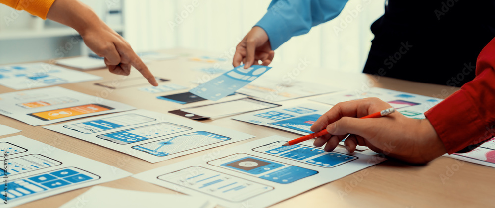 Panorama banner of startup company employee planning on user interface prototype for mobile application or website in office. UX UI designer brainstorm user friendly interface plan. Synergic Panorama banner of startup company employee planning on user interface prototype for mobile application or website in office. UX UI designer brainstorm user friendly interface plan. Synergic