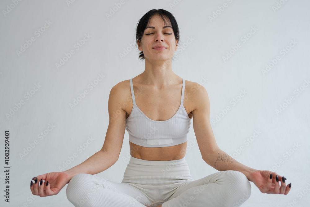 Yoga mindfulness meditation. Healthy woman practicing yoga isolated on white background. Woman sitting in lotus pose meditating relaxing. Girl doing breathing practice. Yoga on white background