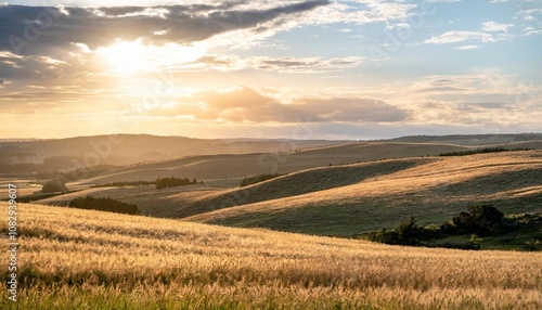 Rolling Hills and Golden Fields Stretching Across the Horizon, Bathed in the Warm Light of a Golden Sunset With Soft Clouds and a Gentle Breeze Blowing Through the Grass