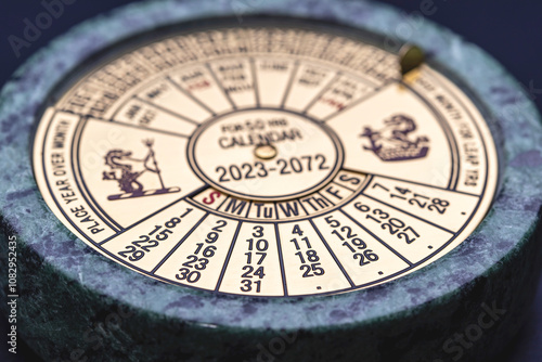 A studio macro shot for a theme of Equinox, with a studio shot of a perpetual calendar set into marble, focussed on the date of the Equinox, the 22 September 2024.