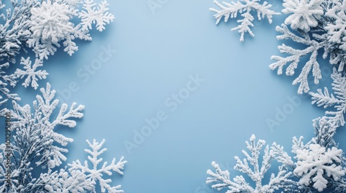 Pastel blue christmas background with snowflake border for text