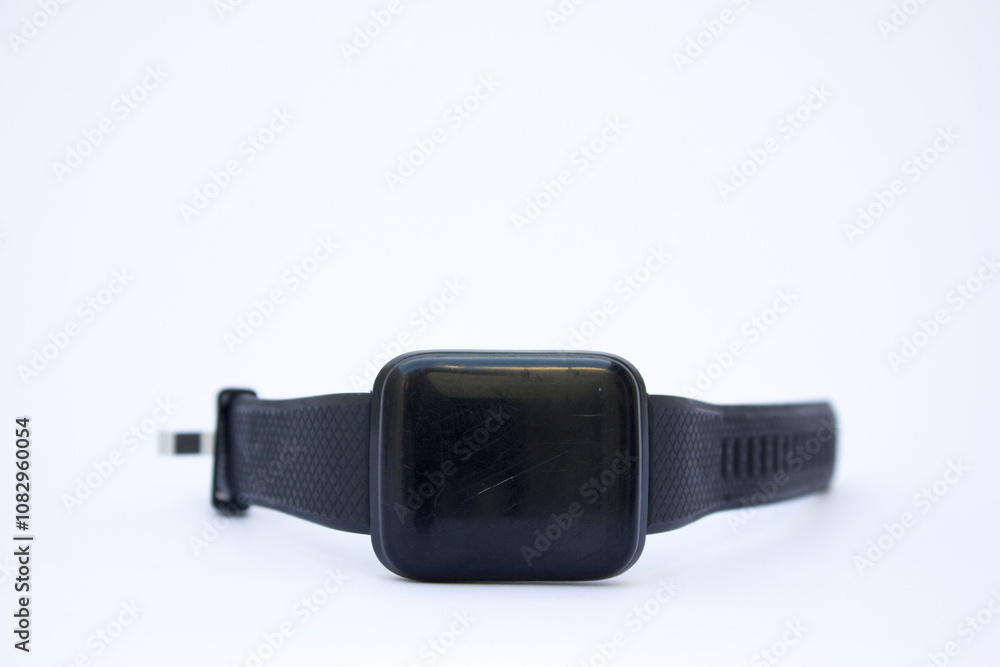 A professional mockup of a black square smartwatch set against a clean, white background, emphasizing its elegant design and functionality, perfect for advertising campaigns and product launches. A professional mockup of a black square smartwatch set against a clean, white background, emphasizing its elegant design and functionality, perfect for advertising campaigns and product launches.