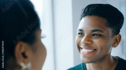 Horizontal video, a Black transgender man smiling