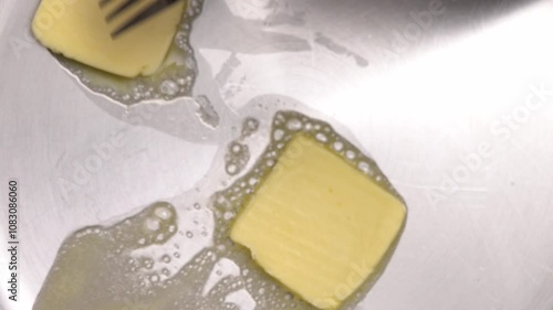 Melting butter in a frying pan creates a rich base for a delicious meal, enhancing flavors and adding creaminess