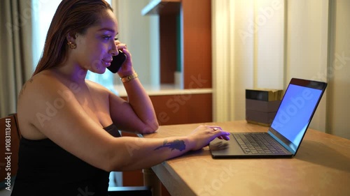 Beautiful latin woman typing on keyboard laptop sitting at desk