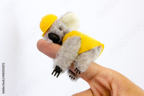 Photography This image showcases a handcrafted mini koala doll, featuring unique stitching and intricate details that highlight its artisanal quality