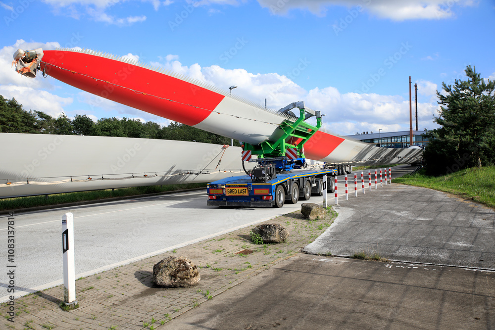 Fototapeta premium Transportation of a wind turbine blade by truck in Germany