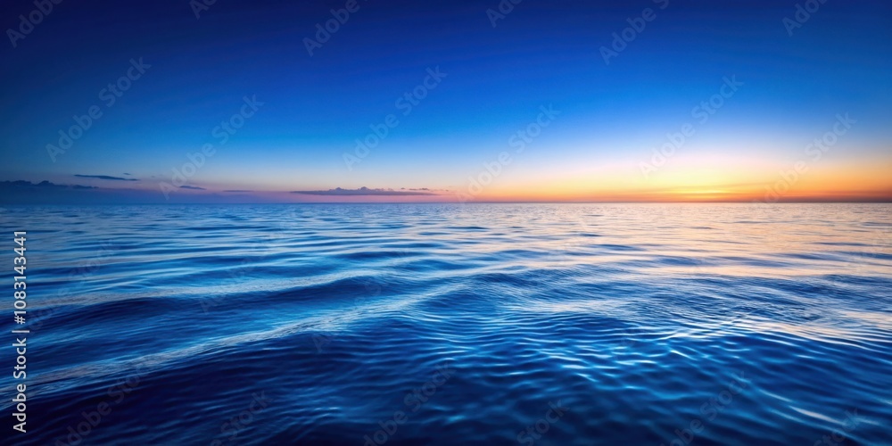 Obraz premium A calming seascape with gentle waves reflecting the golden hues of a fading sunset, creating a serene and tranquil atmosphere