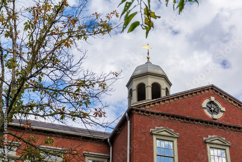 A view of Harvard Hall and its cupola at Harvard University on an autumn day in Cambridge, Massachusetts, USA