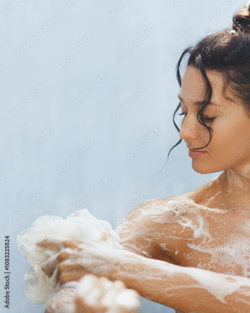Fototapeta premium A close-up shot of a woman enjoying a soothing shower, her skin covered in rich foamy lather. This image embodies the essence of relaxation, self-care, and beauty, perfect for wellness or skincare