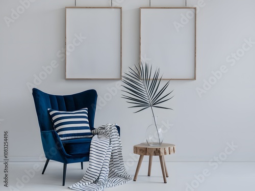 A minimalist interior setting with two large blank frames hung vertically on a white wall.