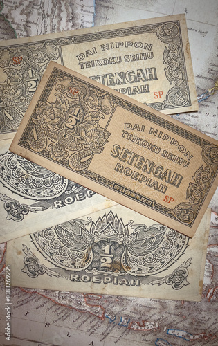 collection of old half rupiah banknotes.