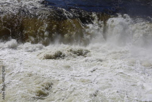 The threshold of the waterfall. The rushing water.