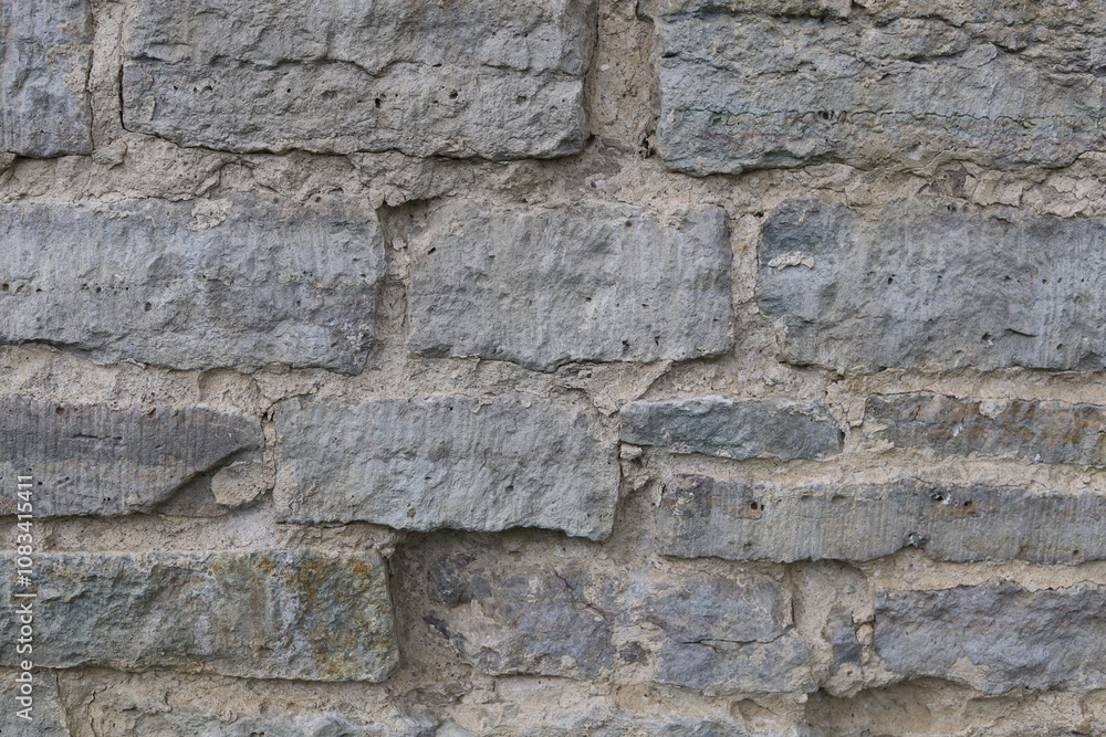 Obraz premium The texture of the destroyed brickwork of the Middle Ages. Preserved fortress walls.