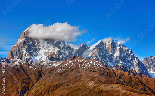 Mount Ushba, Georgia. This is one of the most famous and picturesque mountains of the Caucasus, famous for its two peaks and difficult routes for climbers.