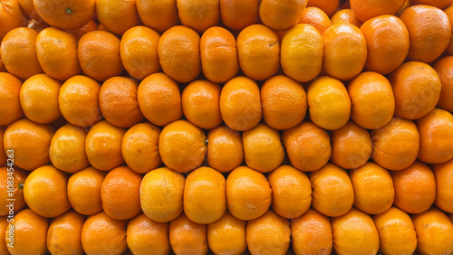 Pile of oranges in market. A lot of fresh oranges in supermarket. Healthy foods for diets