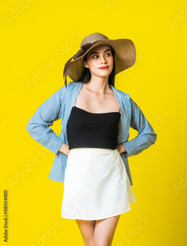 Stylish Western Lady Showcasing Minimalist Skirt Design With a Yellow background