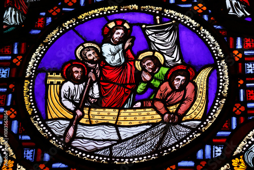 Saint Martin d'Ainay basilica.  Stained glass window.  Jesus and his apostles fishing. The Miraculous catch of fish. Lyon. France. photo