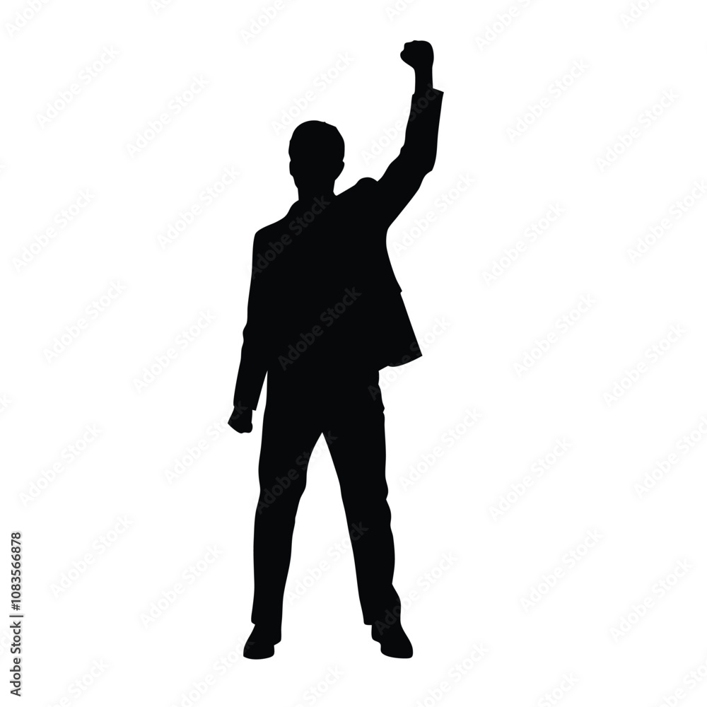 A man is standing in front of a white background. He is wearing a suit and is holding his fist up in the air
