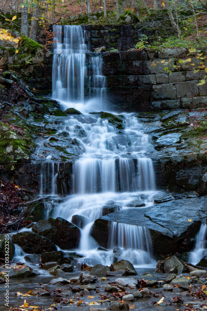 Fototapeta premium Corno alle Scale Regional Park Dardagna Waterfalls in Autumn with Variegated Colors