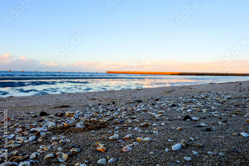 Sunset, purple and orange dawn sky at Shorncliffe pier, jetty, beach and bayside views, QLD photo