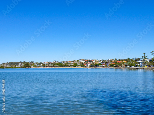 Walking along the seaside at Wynnum jetty and Manly, a beautiful sunny clear and blue sky day  photo