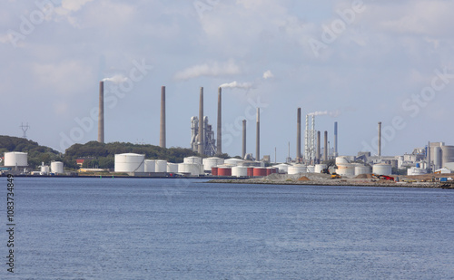 industrial plant with many chimneys and fuel and gas storage tanks photo