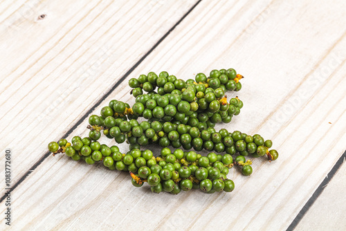 Green pepper corn on the branch photo