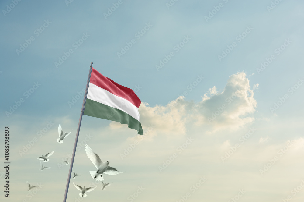 Fototapeta premium Hungary flag waving with flying doves in beautiful sky. Hungary flag for Republic Day and Independence Day.