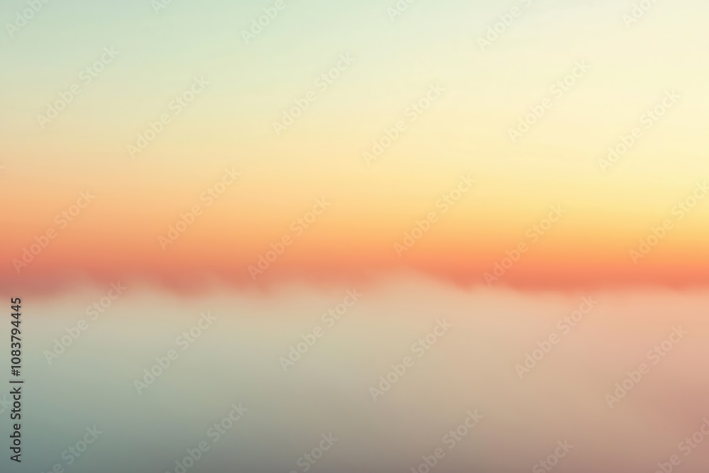 Obraz premium Soft pastel colors blend in the sky as the sun rises over a serene horizon at dawn