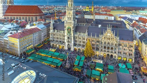 Munich skyline Christmas Market timelapse featuring the festive stalls at Marienplatz, the magnificent New Town Hall and vibrant holiday atmosphere in Bavaria, Germany.