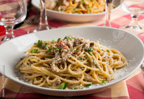 spaghetti with anchovies fresch tomatoes and parsley photo