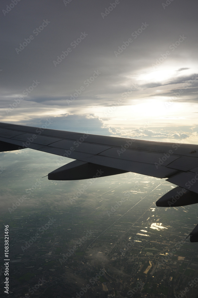 Fototapeta premium Airplane wing and clouds, taken on an airplane photo