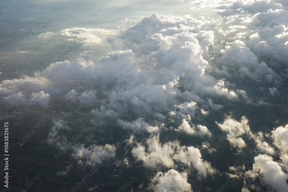 Fototapeta premium cloudy light sky background with clouds photo on plane moment beautiful top view