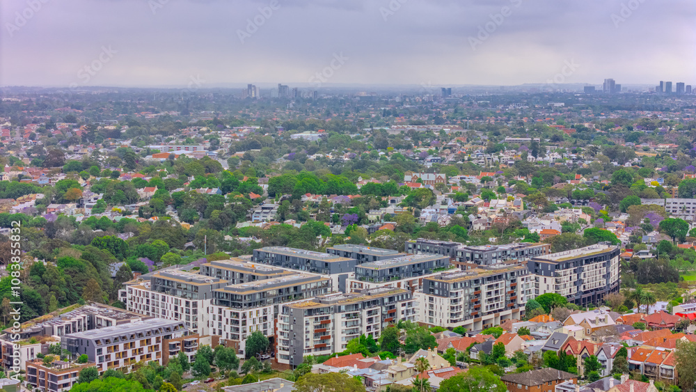 Obraz premium Aerial drone view over Sydney inner suburb of Glebe and Annandale close to Sydney Harbour NSW Australia beautiful colourful roof and tree lined streets green orange purple