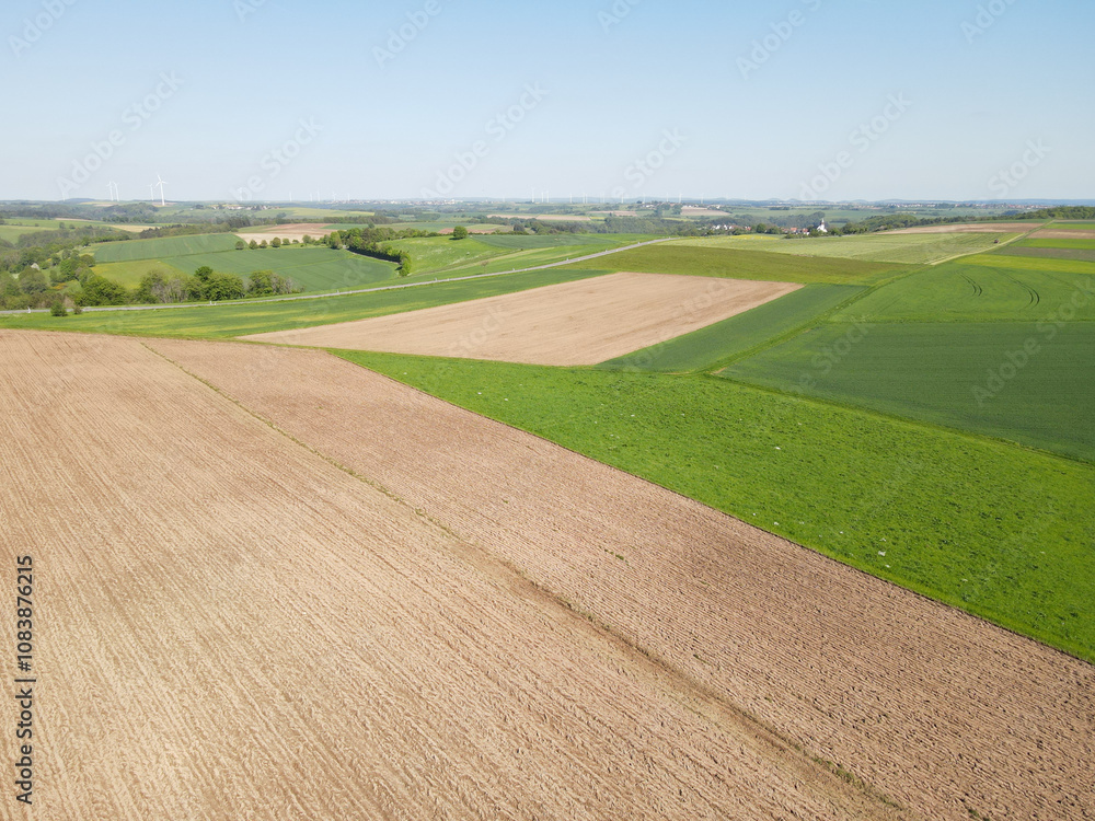 Naklejka premium View from above agriculture fields on a sunny day in spring 