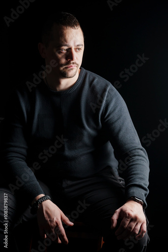 Portrait of a Contemplative Man in Low Light