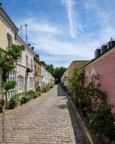 Canvas Print London - 06 16 2022: Pastel-colored houses in Ennismore Gardens Mews