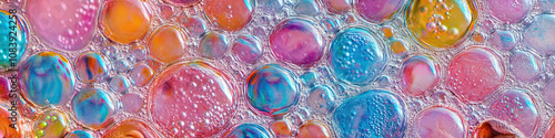 A close-up of colorful bubbles on the surface of a watering hole, in the African savanna. photo