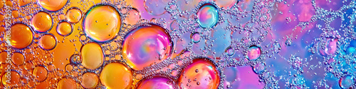 A close-up of colorful bubbles on the surface of a watering hole, in the African savanna. photo