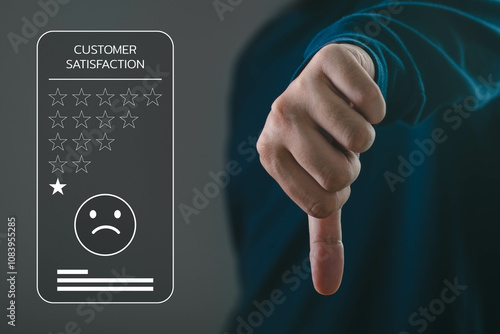 A hand making a thumbs down gesture symbolizes customer dissatisfaction and poor feedback in a digital context.