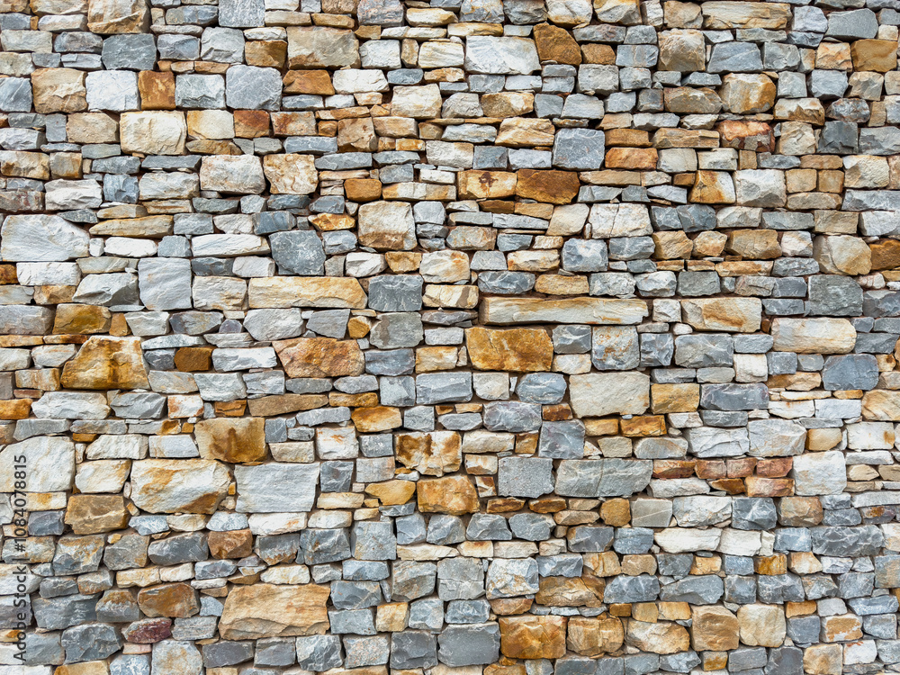 Obraz premium Stonewall background texture. building facade stone wall material