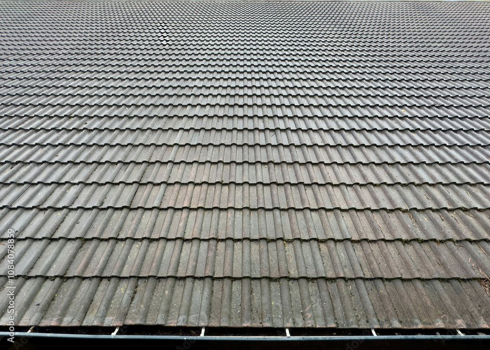 Fototapeta premium Roof tile backround texture, Grey color tiles construction closeup view