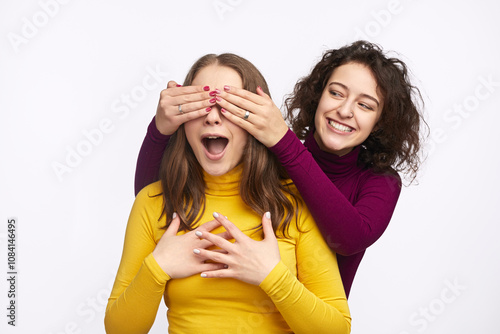 фотографія Two best friends enjoy a playful surprise moment, sharing laughter and joy