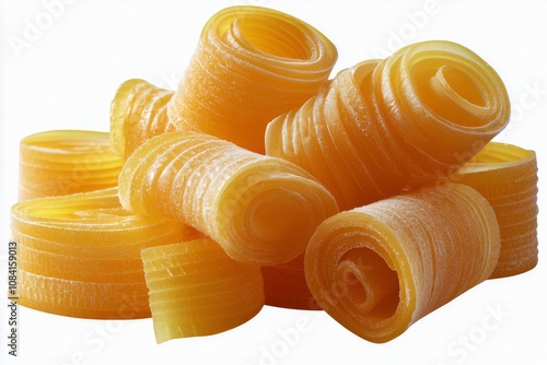 Freshly made yellow pasta sheets stacked on top of each other in a creative a...