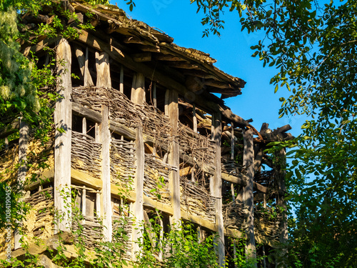 Old abandoned barn, traditional wattle and daub construction at Baba Stana Neighborhood, Oreshak, Balkan Mountains, Troyan Municipality, Northern Bulgaria photo