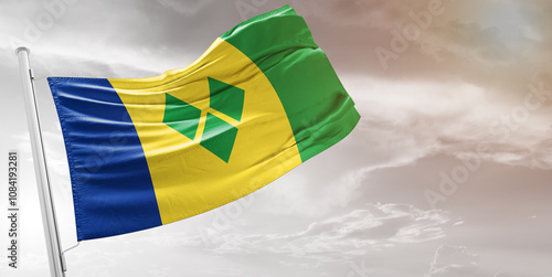 Cuadro en lienzo Saint Vincent and the Grenadines national flag cloth fabric waving on beautiful grey Background