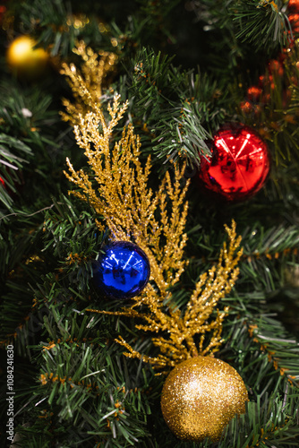 Merry Christmas and Happy New Year, decorations balls toys on the Christmas tree, a classic winter holidays home decor, christmas background, New Year's sales and purchases, closeup, vertical image